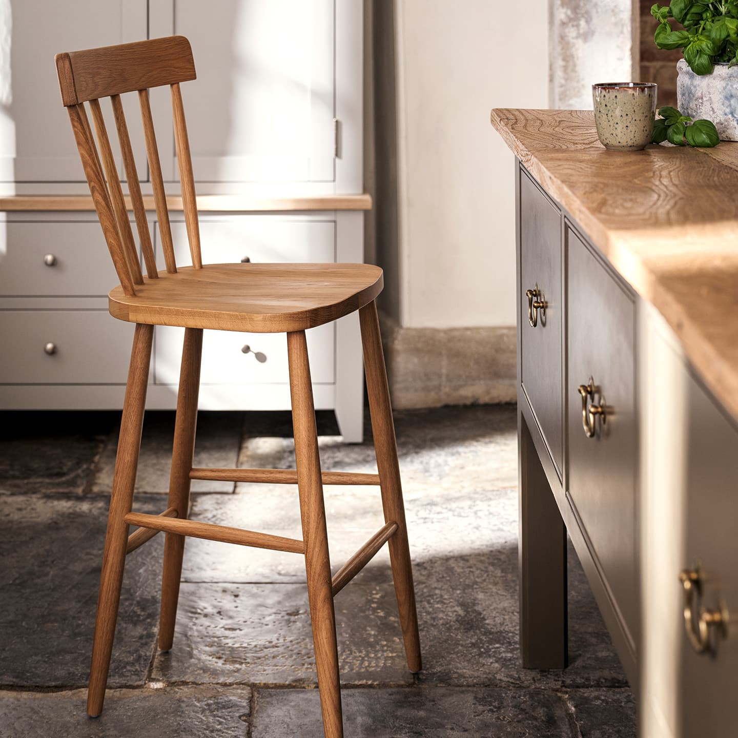 Wood spindleback bar stool seat in kitchen